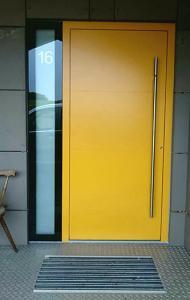 Bright yellow modern front door