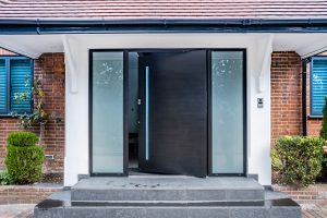 pivot door from- RK Doors with glass sidelights