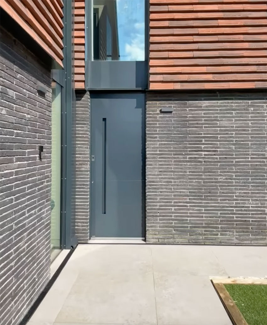 Recessed handle on modern grey door