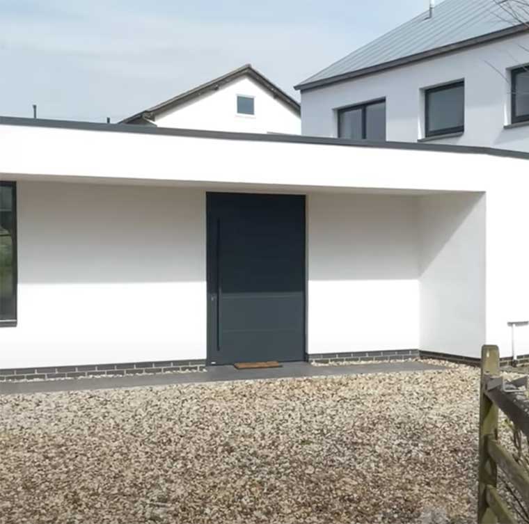 Modern grey Pivot door on modern home