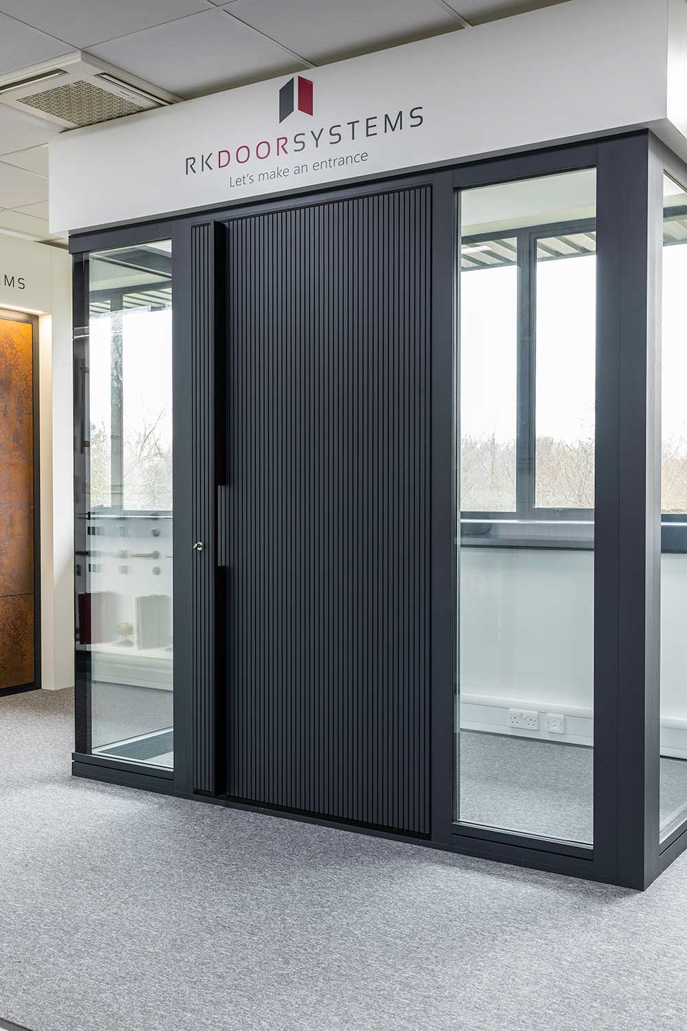 Modern slatted aluminium door Hertford showroom
