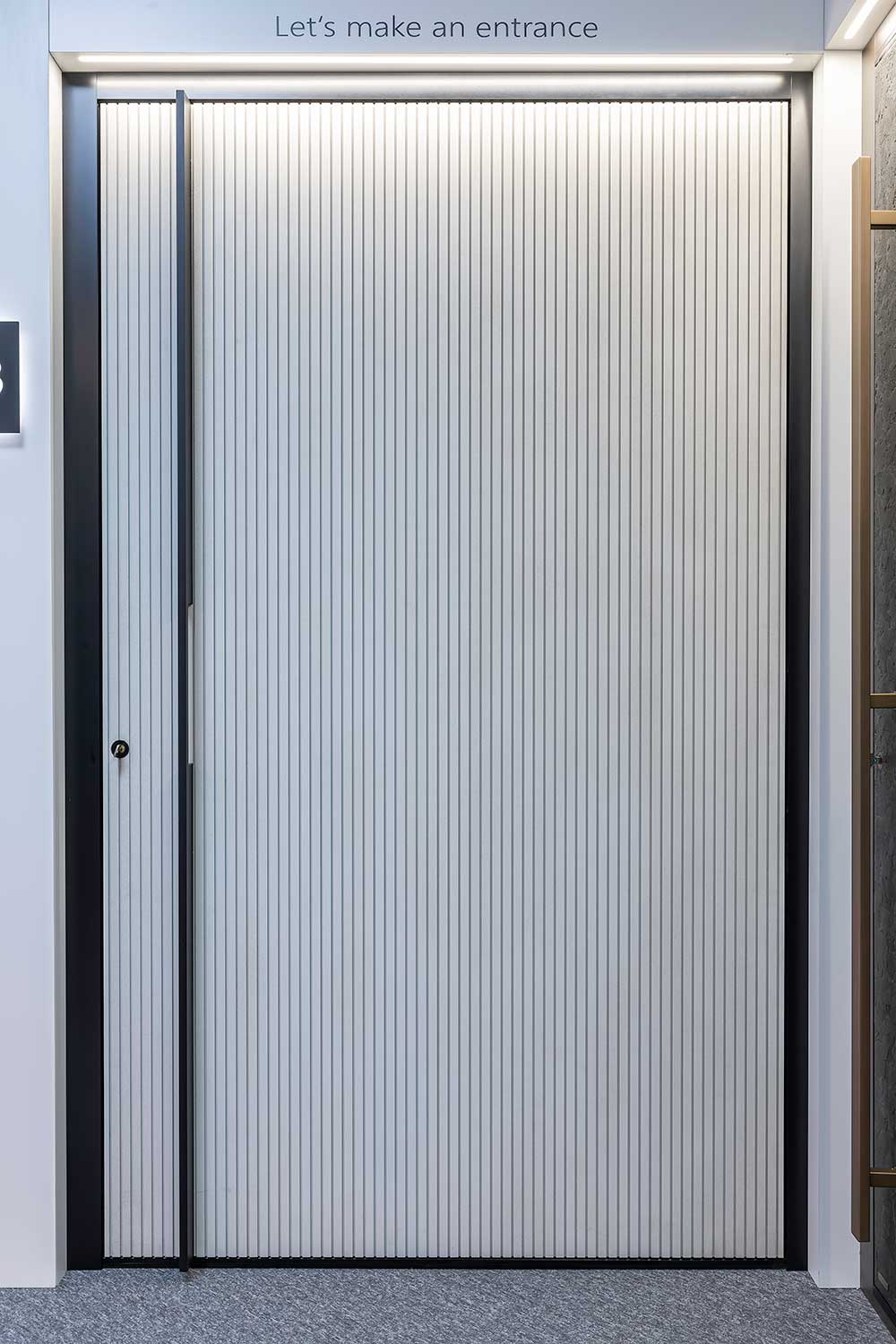 White slatted besoke aluminium door Hertford showroom