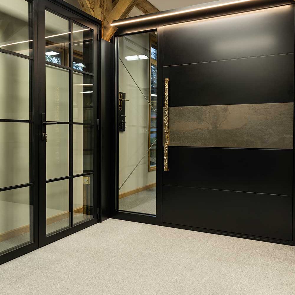 surrey showrrom 38894 RK Aluminium pivot door with custom handle at the Surrey showroom